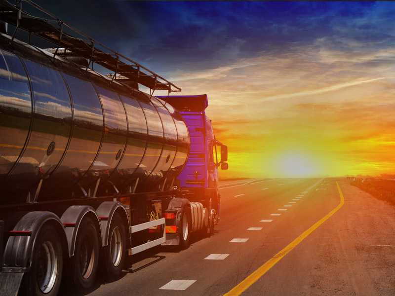 fuel-delivery-rolling-road Fuel transport truck rolling down the road